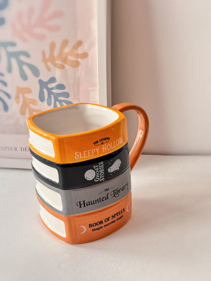 Tazza libri della biblioteca infestata