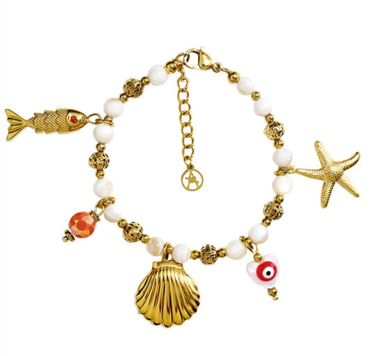 Bracciale charms, perle e conchiglie
