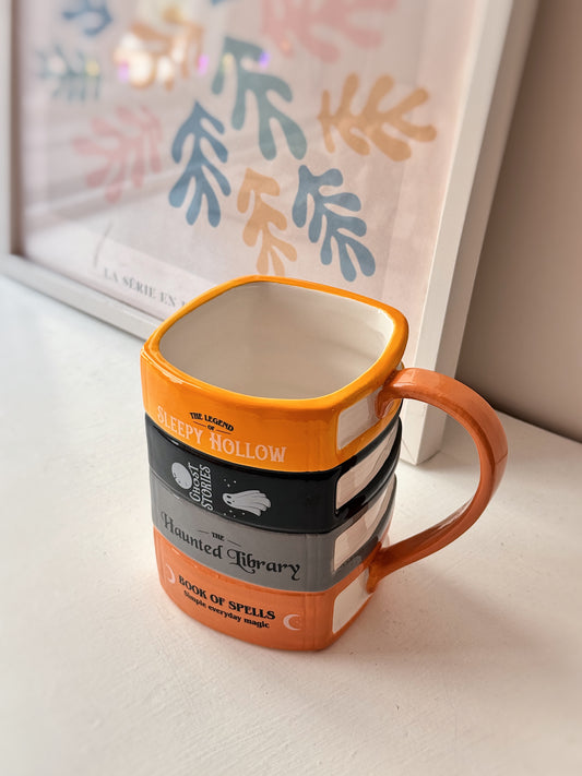 Tazza libri della biblioteca infestata