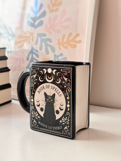 Tazza libro degli incantesimi gatto nero